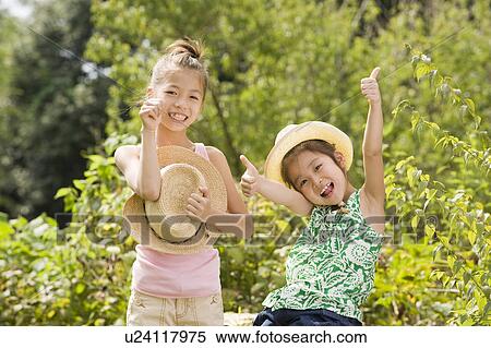 Girls with thumbs up, Chiba Prefecture, Honshu, Japan View Large Photo Image Stock Photography - Girls with thumbs up, Chiba Prefecture, Honshu, Japan. Fotosearch