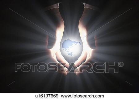 Stock Photo - Globe floating in businessman's hands. Fotosearch
