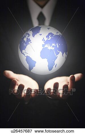 Stock Photo - Globe floating in businessman's hands. Fotosearch