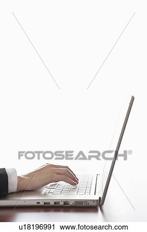 Hand typing a laptop View Large Photo Image Stock Image - Hand typing a laptop. Fotosearch