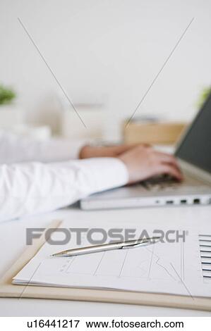 Hand typing a laptop View Large Photo Image Stock Photo - Hand typing a laptop. Fotosearch