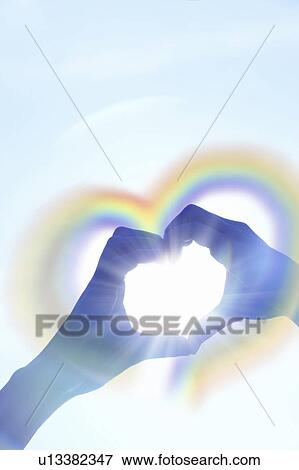Hands forming a heart shape, Digital enhancement View Large Photo Image Stock Photo - Hands forming a heart shape, Digital enhancement. Fotosearch