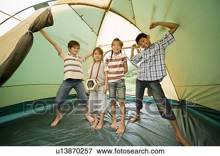 Stock Photo - Kids inside a tent, Chiba Prefecture, Honshu, Japan. Fotosearch