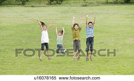 Stock Photography - Kids jumping, Chiba Prefecture, Honshu, Japan. Fotosearch