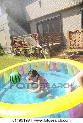 Kids playing with garden hose, Chiba Prefecture, Honshu, Japan View Large Photo Image Picture - Kids playing with garden hose, Chiba Prefecture, Honshu, Japan. Fotosearch