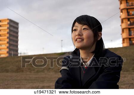 Stock Image - Low Angle View of Teenage Girl at Dawn. Fotosearch