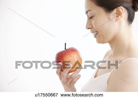 Stock Photo - Mature Woman Having Apple. Fotosearch