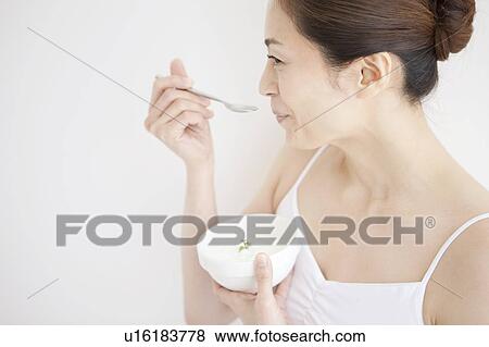 Mature Woman Having Yogurt View Large Photo Image Stock Photo - Mature Woman Having Yogurt. Fotosearch