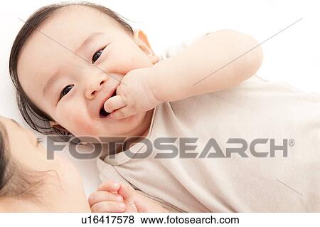 Mother and Baby Boy with Finger in Mouth View Large Photo Image Stock Photo - Mother and Baby Boy with Finger in Mouth. Fotosearch