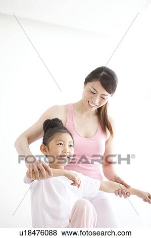 Stock Photo - Mother and Daughter Exercising. Fotosearch
