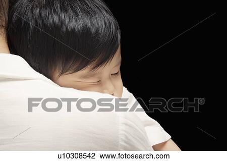 Mother carrying baby View Large Photo Image Stock Image - Mother carrying baby. Fotosearch