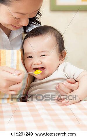 Mother Feeding Baby Boy View Large Photo Image Stock Photo - Mother Feeding Baby Boy. Fotosearch