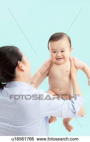 Mother Holding Up Baby Boy View Large Photo Image Stock Photograph - Mother Holding Up Baby Boy. Fotosearch