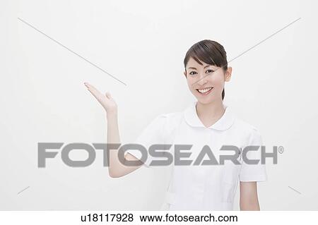 Stock Photo - Nurse with hand raised. Fotosearch