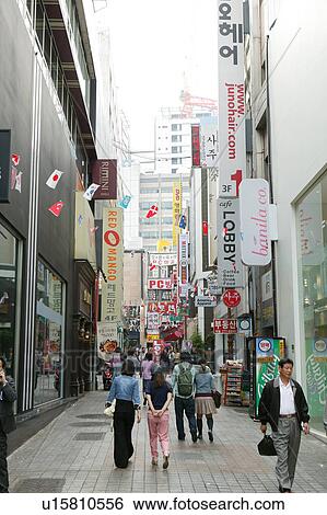 Stock Photograph - Pedestrians and Shops. Fotosearch