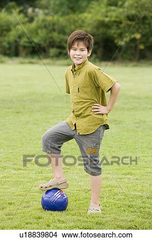 Portrait of a boy with soccer ball, Chiba Prefecture, Honshu, Japan View Large Photo Image Picture - Portrait of a boy with soccer ball, Chiba Prefecture, Honshu, Japan. Fotosearch