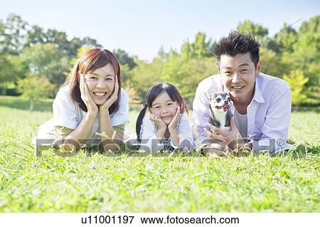 Stock Photo - Portrait of family and Chihuahua. Fotosearch