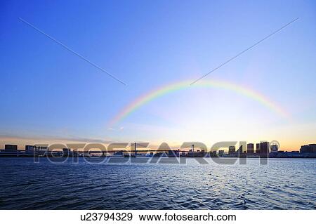 Stock Photo - Rainbow over Rainbow Bridge and Tokyo Bay. Fotosearch
