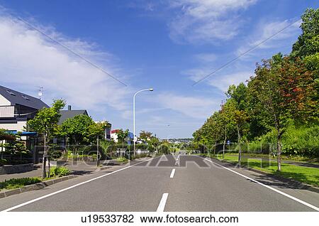 Stock Image - Road in Residential District. Fotosearch