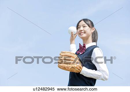 Stock Photography - Schoolgirl Playing Baseball. Fotosearch