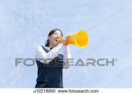 Stock Image - Schoolgirl Using Megaphone. Fotosearch