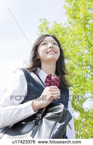 Stock Photograph - Schoolgirl Walking. Fotosearch