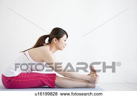 Stock Photo - Side View of Mature Woman Stretching. Fotosearch