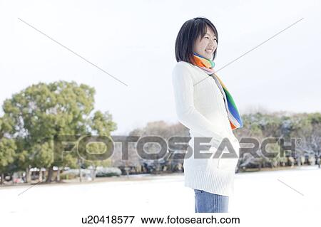 Stock Photo - Side View of Teenage Girl in Winter. Fotosearch