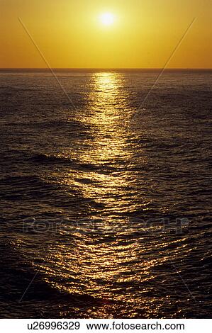 Stock Photo - Sun Rising Above Sea. Fotosearch