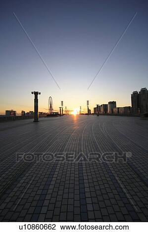 Stock Image - Sun Setting Over Tokyo. Fotosearch