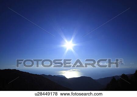 Stock Photo - Sun Shining Brightly Over Sea. Fotosearch