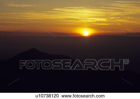 Stock Image - Sunrise Over Mountains. Fotosearch