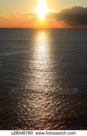 Stock Image - Sunrise Over Ocean. Fotosearch