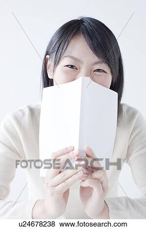 Teenage Girl Hiding Behind Book View Large Photo Image Stock Photo - Teenage Girl Hiding Behind Book. Fotosearch
