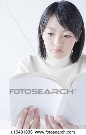Stock Image - Teenage Girl Reading Book. Fotosearch