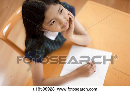 Stock Photo - Teenage girl studying . Fotosearch