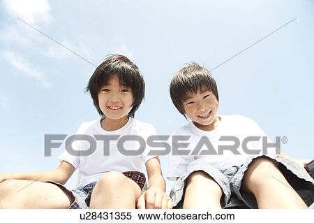 Stock Photography - Two boys looking at camera. Fotosearch