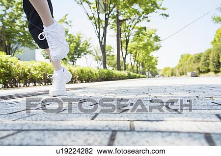 Woman jogging View Large Photo Image Stock Image - Woman jogging. Fotosearch