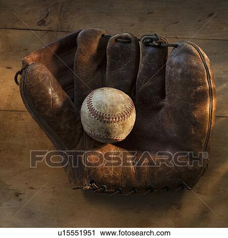 Antique baseball on baseball glove with bat View Large Photo Image Stock Image - Antique baseball on baseball glove with bat. Fotosearch