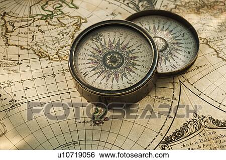 Stock Photograph - Antique compass on map. Fotosearch
