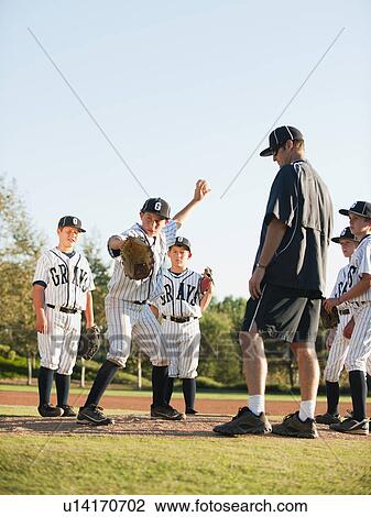 Baseball coach and boys (10-11) standing on baseball diamond View Large Photo Image Stock Image - Baseball coach and boys (10-11) standing on baseball diamond. Fotosearch