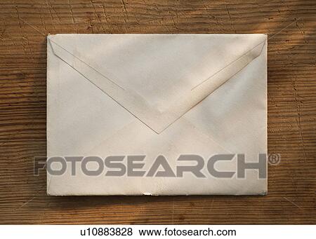 Blank envelope on wooden table View Large Photo Image Stock Photo - Blank envelope on wooden table. Fotosearch