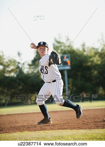 Picture - Boy (10-11) playing baseball. Fotosearch