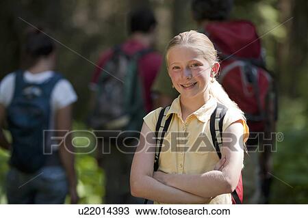 Stock Image - Canada, British Columbia, Fernie, Family hiking on trail. Fotosearch