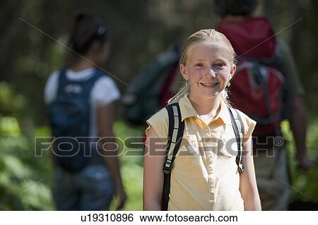 Stock Photograph - Canada, British Columbia, Fernie, Family hiking on trail. Fotosearch