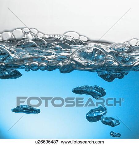 Stock Photo - Close up of blue water surface with bubbles. Fotosearch