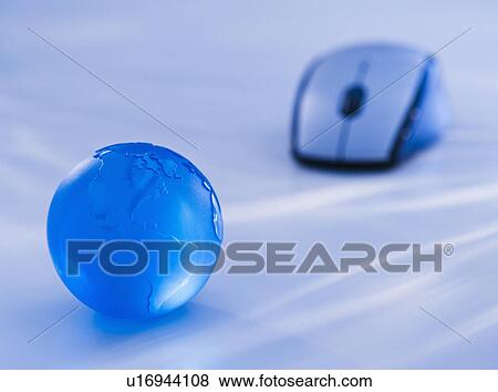 Close-up view of blue computer mouse and globe View Large Photo Image Stock Photo - Close-up view of blue computer mouse and globe. Fotosearch