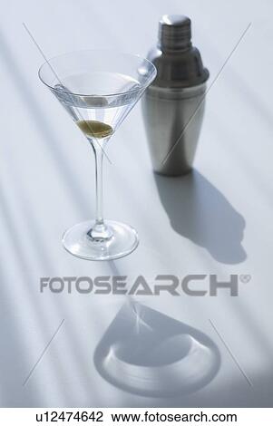 Stock Image - Cocktail shaker and cocktail in glass. Fotosearch