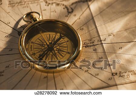 Stock Image - Compass on map. Fotosearch