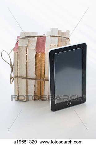 Stock Image - Digital tablet by tied books. Fotosearch